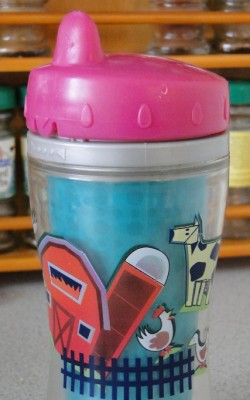 Child's drinking cup showing phallic shaped farm building