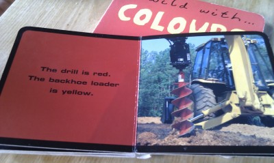 The backhoe loader is yellow
