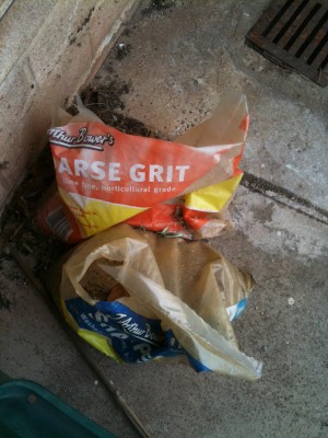 A bag folded so the slogan says Arse Grit