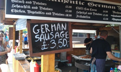 A sign advertising German sausage
