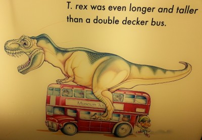 An illustration that looks like T. rex having sex with a bus