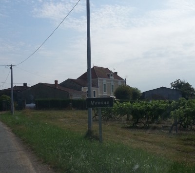 Street sign for Mansac