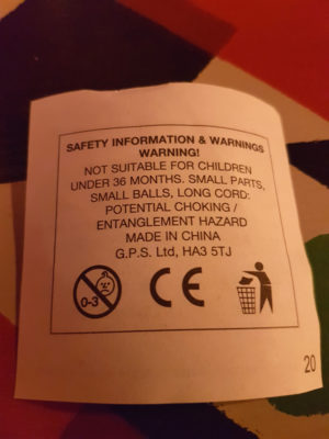 Warning label saying small balls, long cord, potential choking