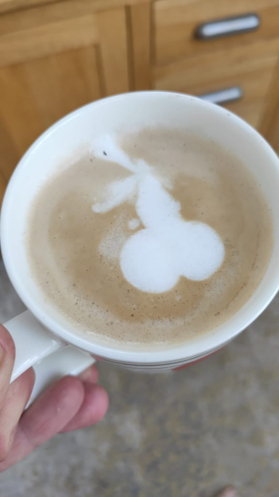 Coffee with a froth pattern that looks like a penis