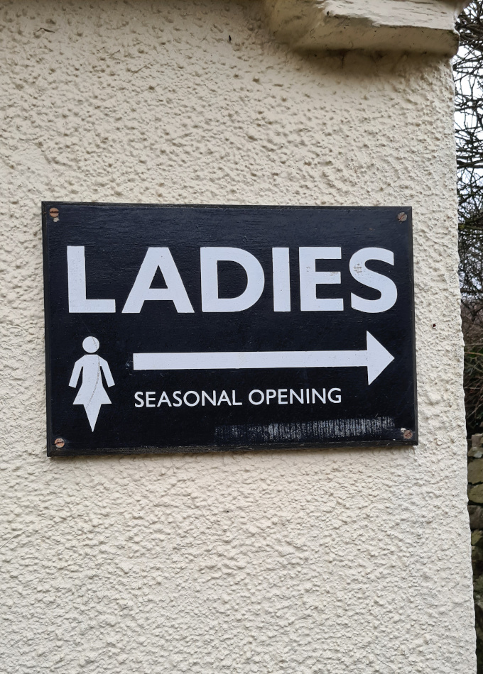 Toilet sign with seasonal opening